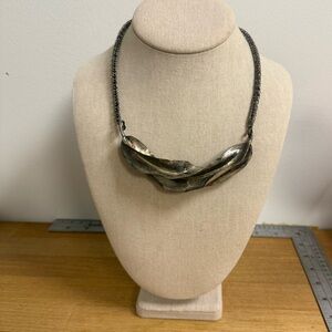 Twisted metal collar necklace in an antique silver color